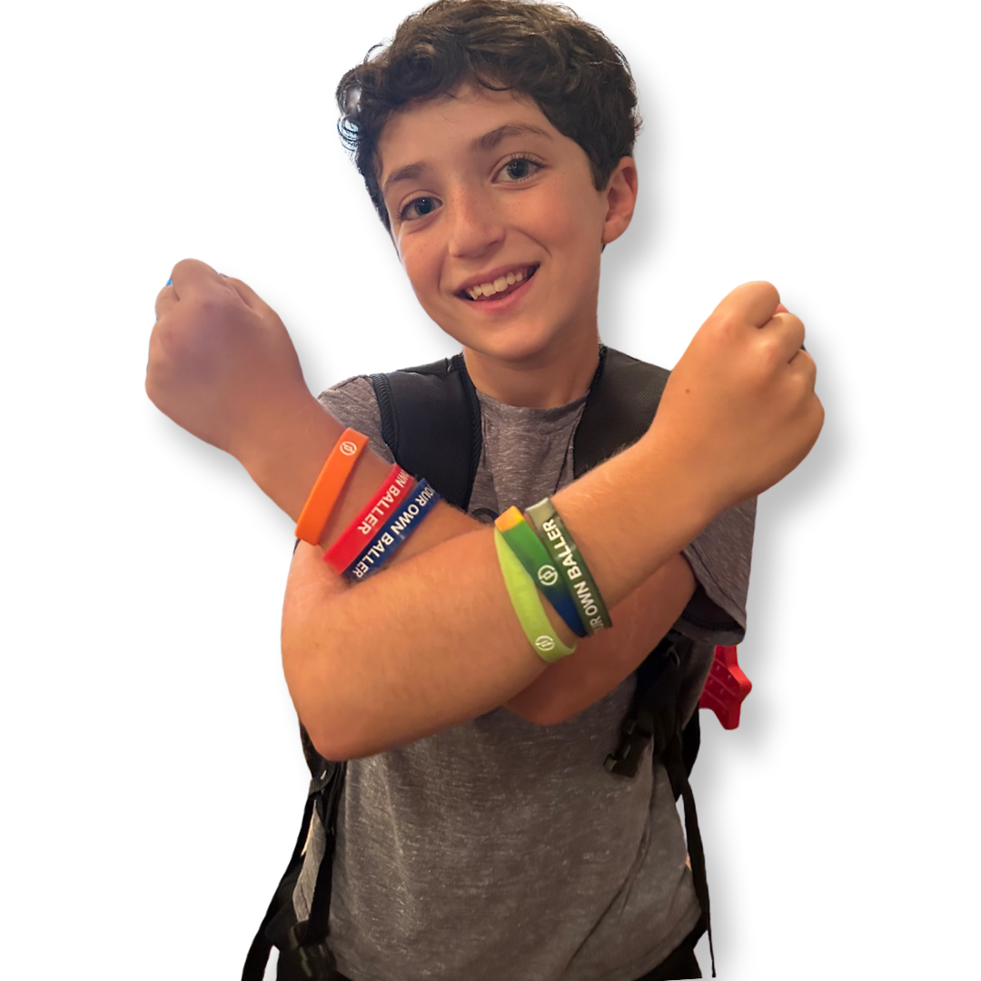 Kid wearing wristbands and crossing their arms